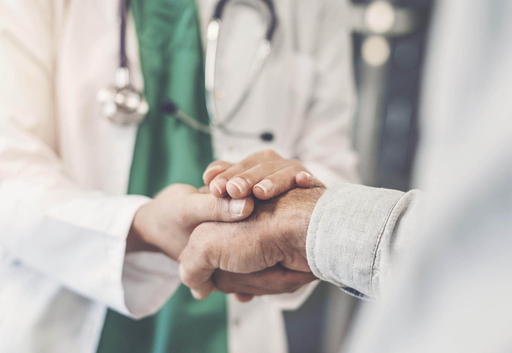 Health professional shaking hands with a patient
