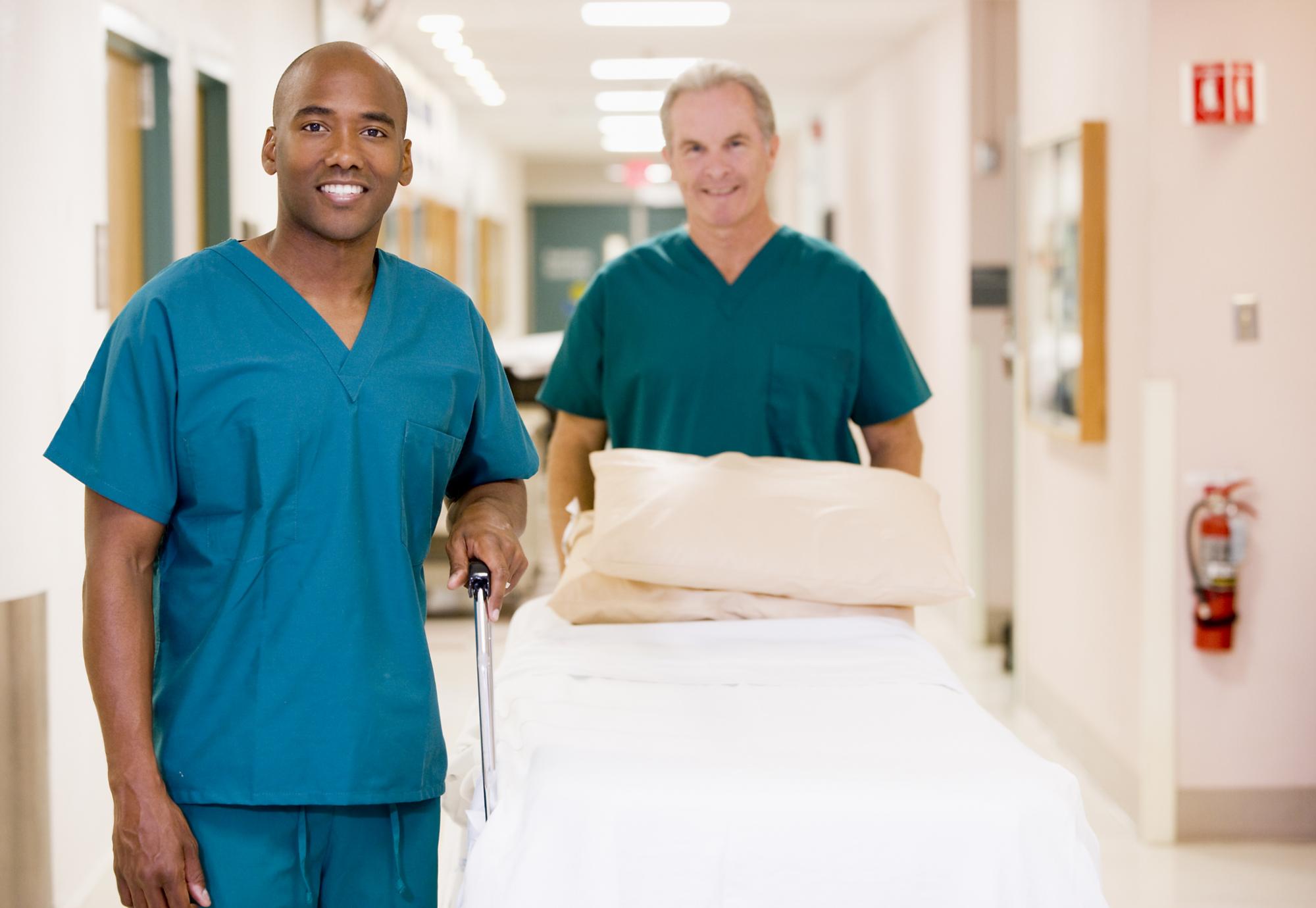 Two porters moving resources around the hospital