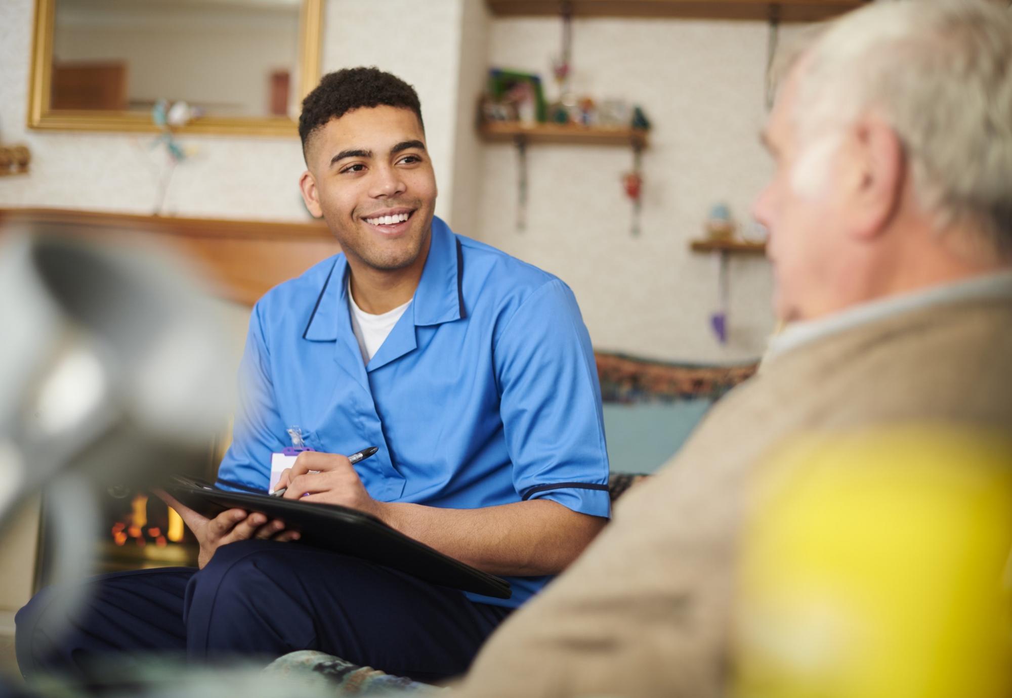 Healthcare support worker talking with a patient