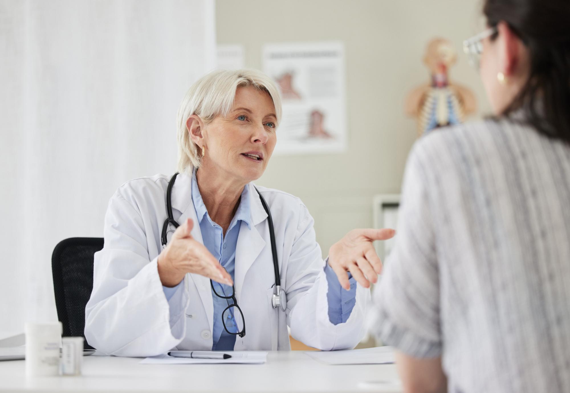 Mature doctor having a consultation with a patient
