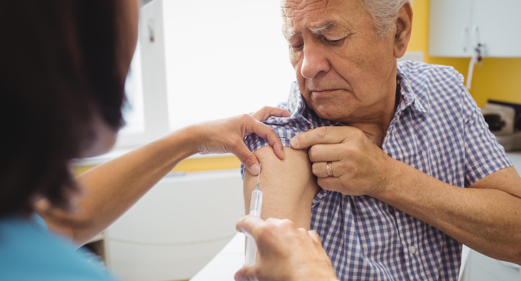 Older person being vaccinated