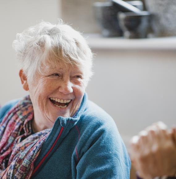 Senior woman smiling in conversation