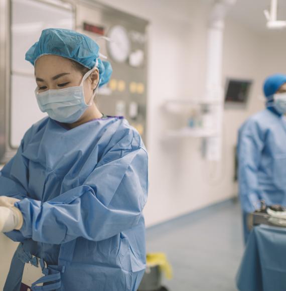 Female clinician in surgical scrubs