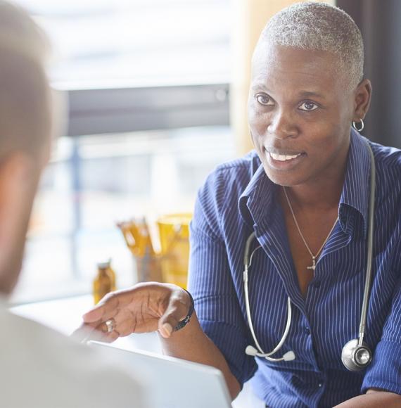 Female GP discussing with patient
