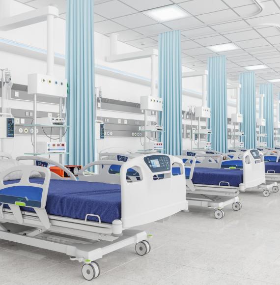 Picture of empty hospital beds.