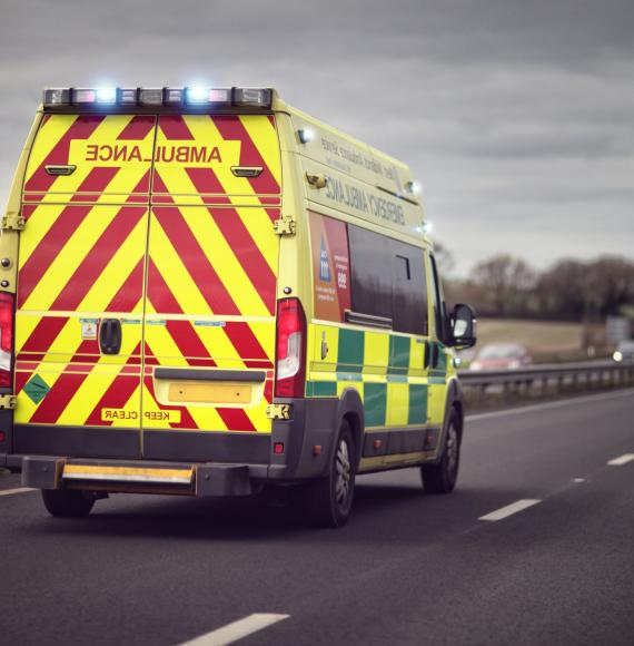 An ambulance on a road in the UK