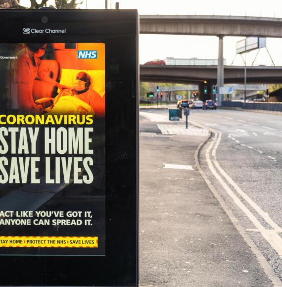Stay Home Save Lives bus stop advertisement
