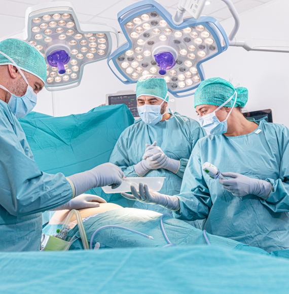 Surgical team performing an operation on a patient