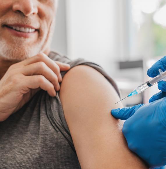 Patient receiving a vaccine jab