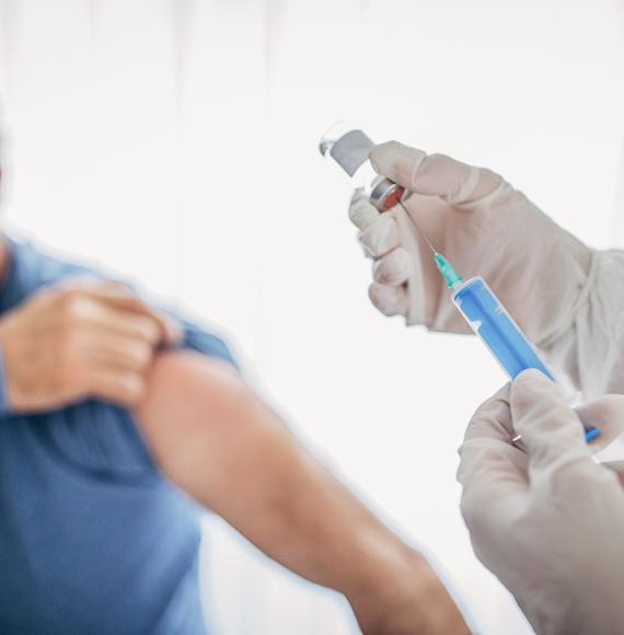 Man preparing to receive vaccine jab