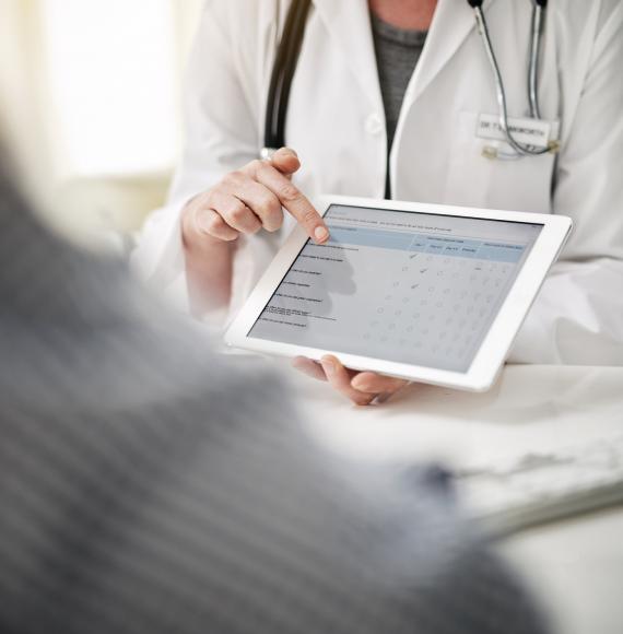 Health professional accessing a form on a tablet PC