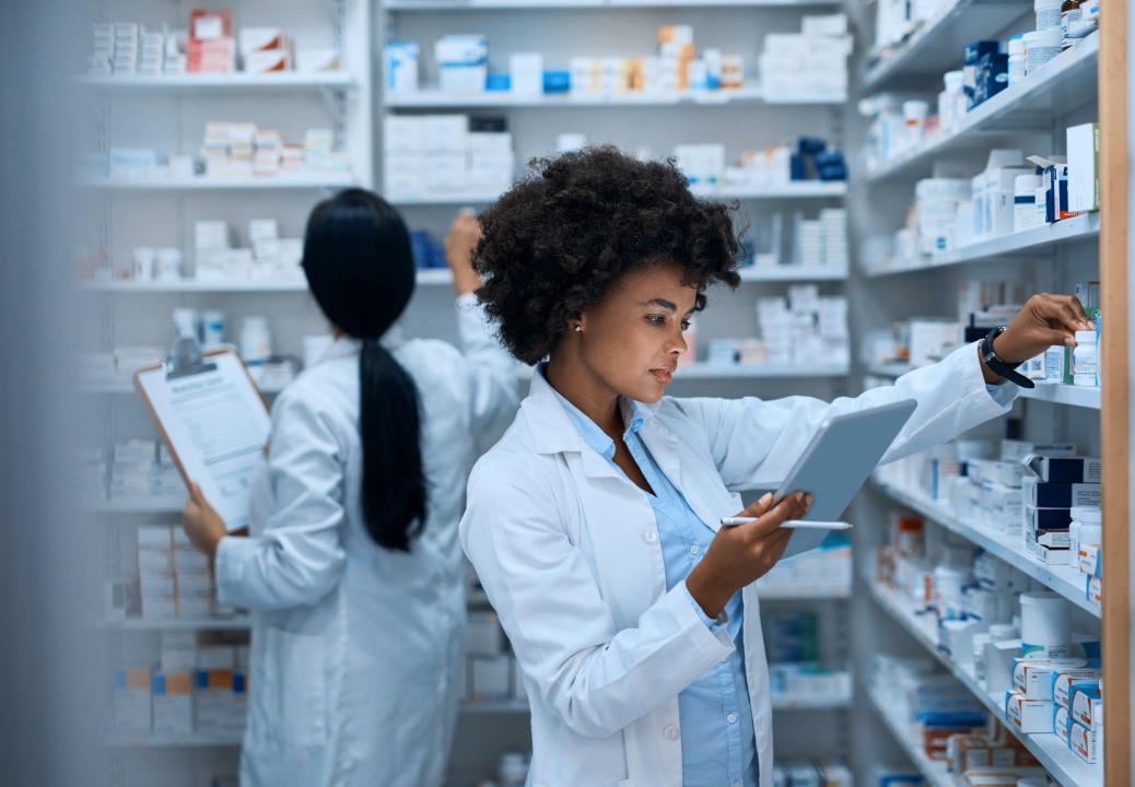 Pharmacist checking medicines