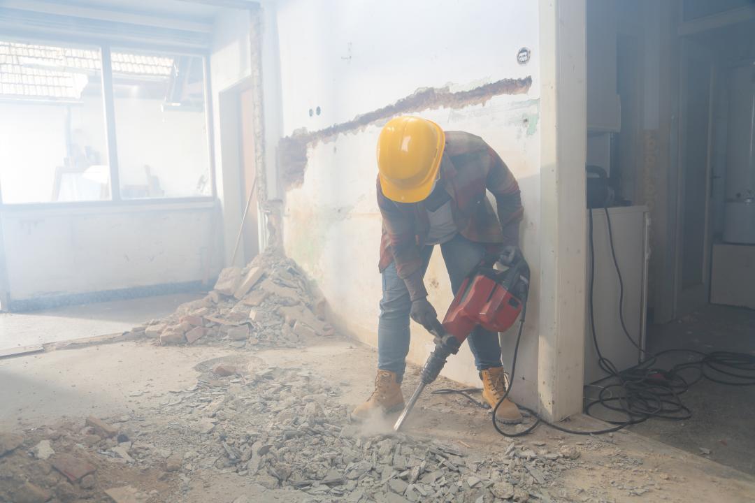 Demolition worker using a jackhammer