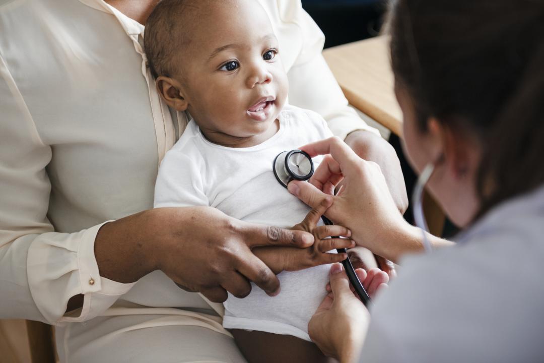 Baby being examined by a doctor