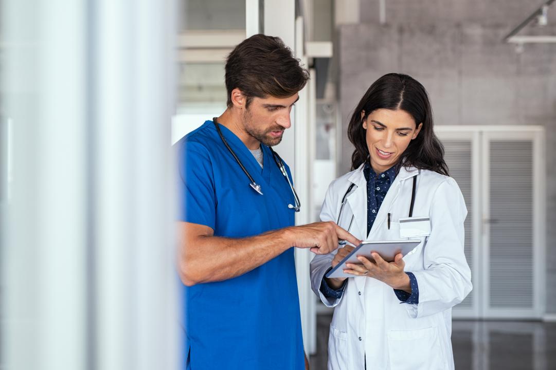 Doctor and nurse discussing medical information