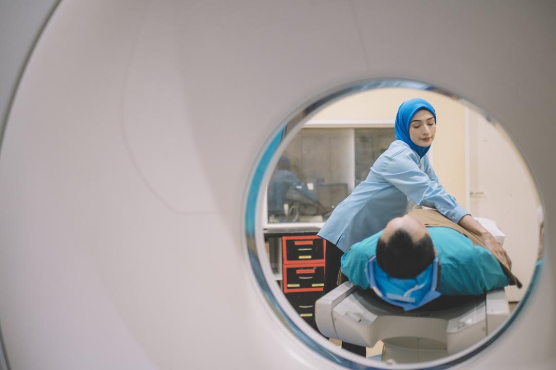 Patient entering a CT scanner