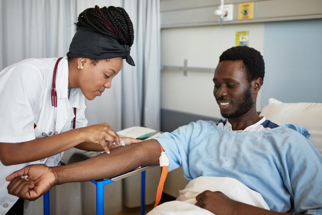 Medical professional taking blood from a patient