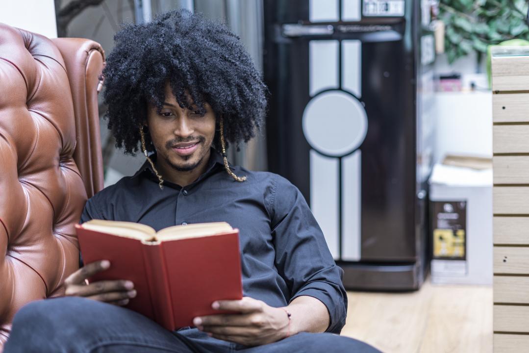 Young man reading a book