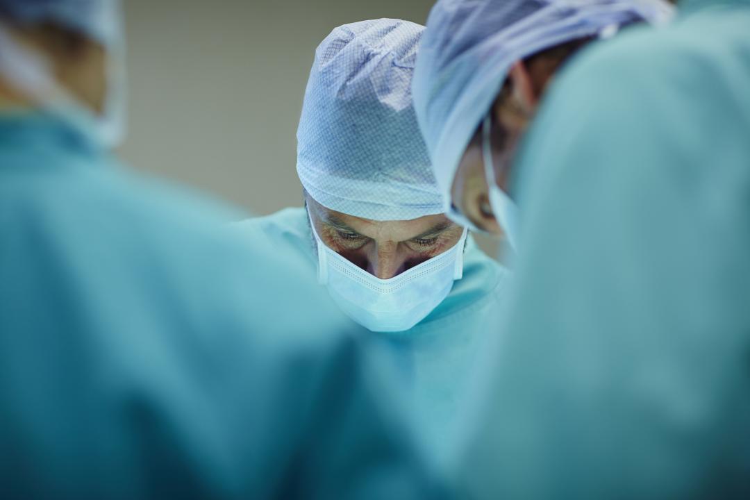 Surgeon focusing as they perform an operation