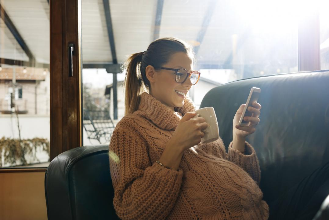 Pregnant woman checking her phone