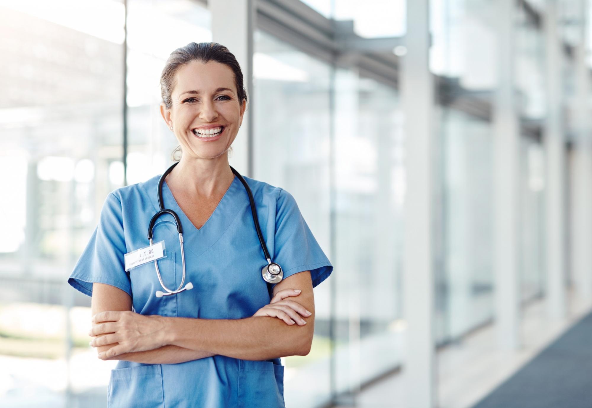 Female nurse stood in hallway [reversed]