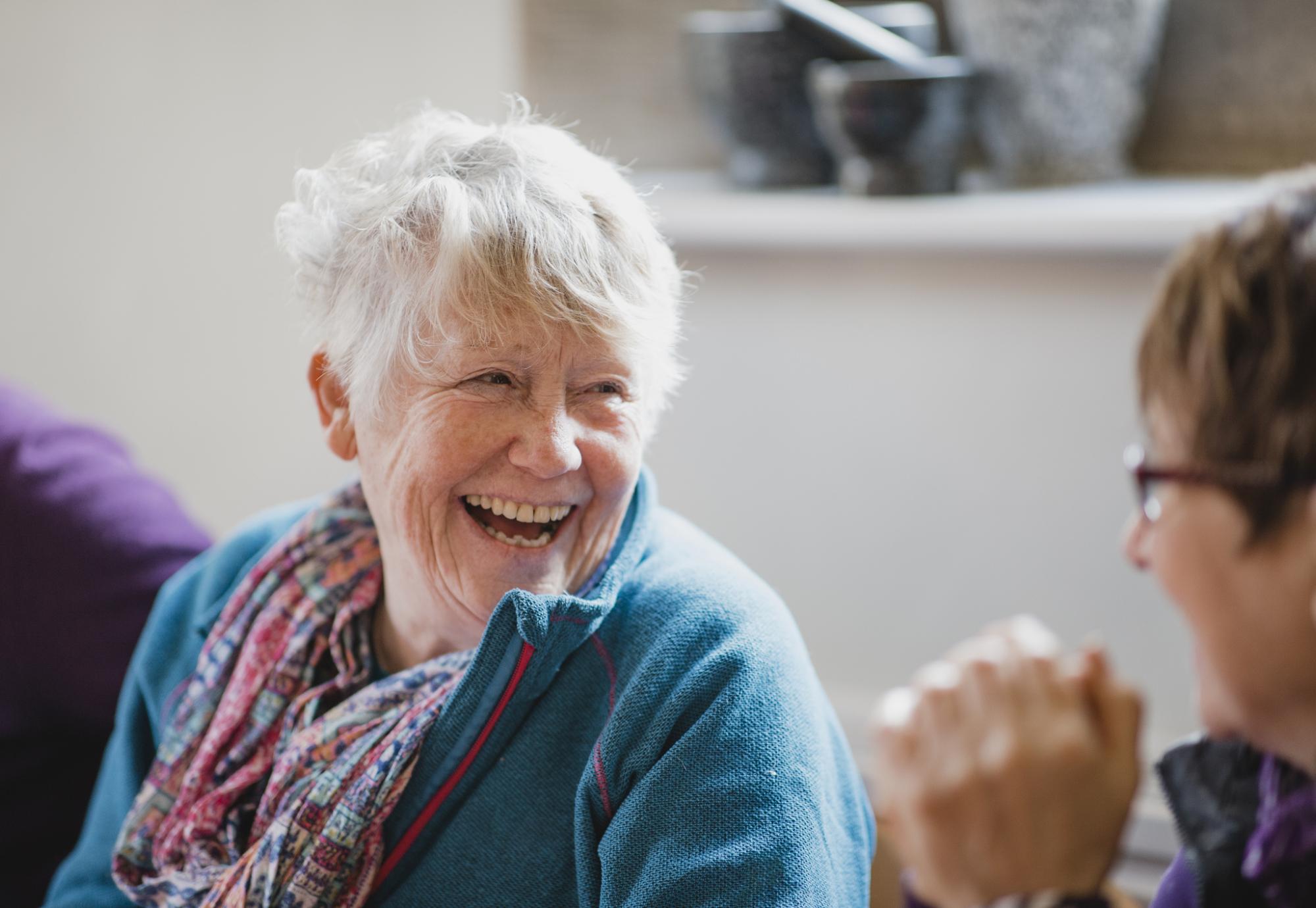 Senior woman smiling in conversation