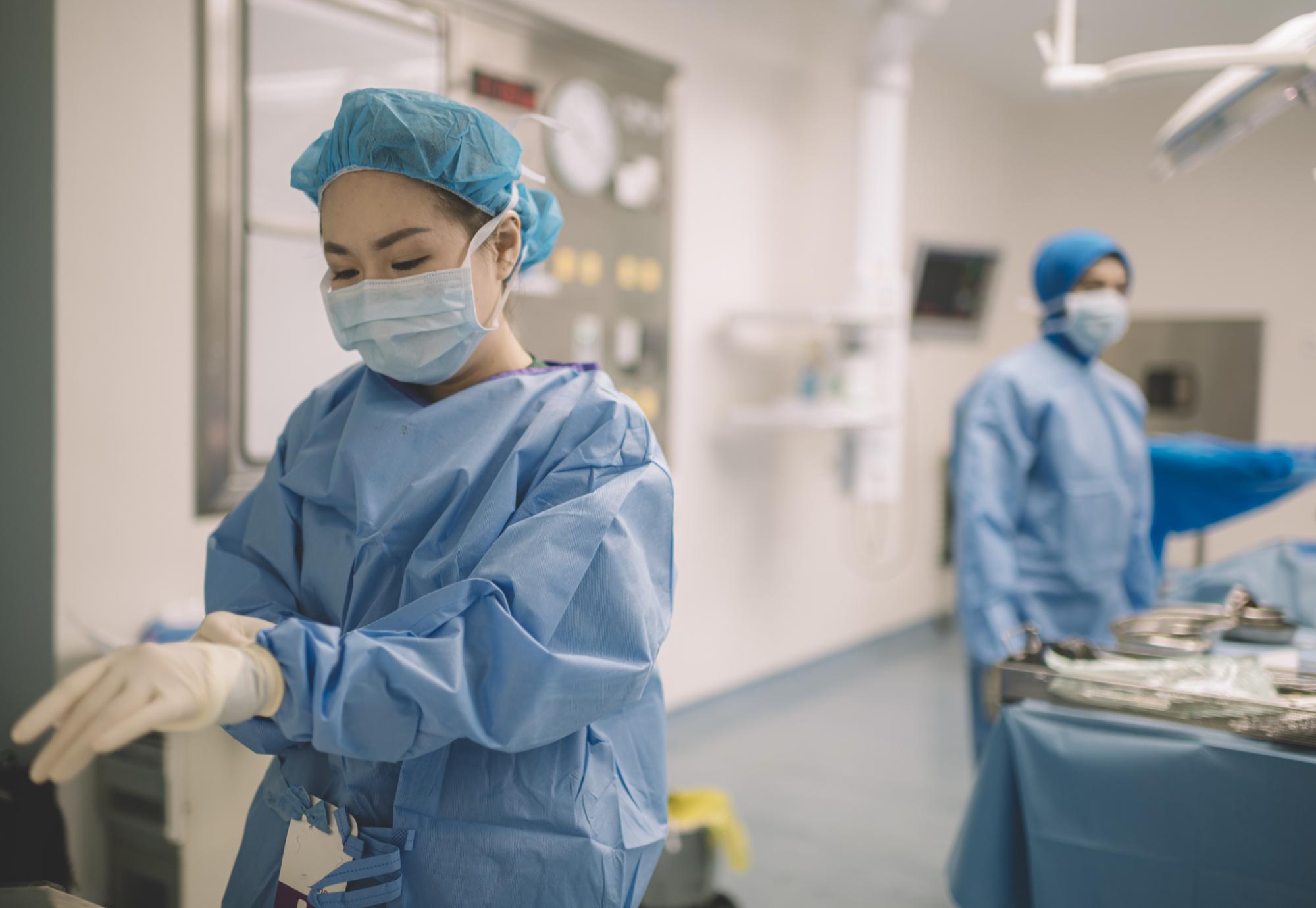 Female clinician in surgical scrubs