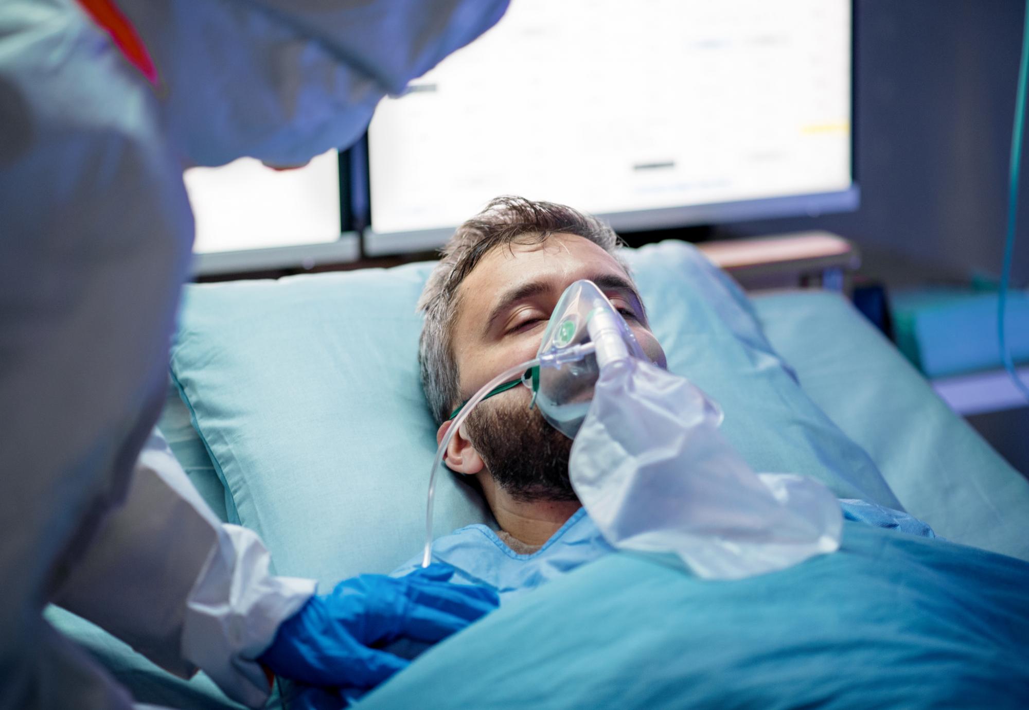 Male patient requiring breathing equipment