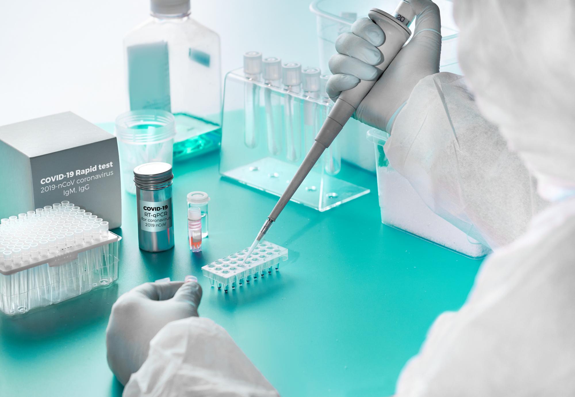 Lab technicians using pipette