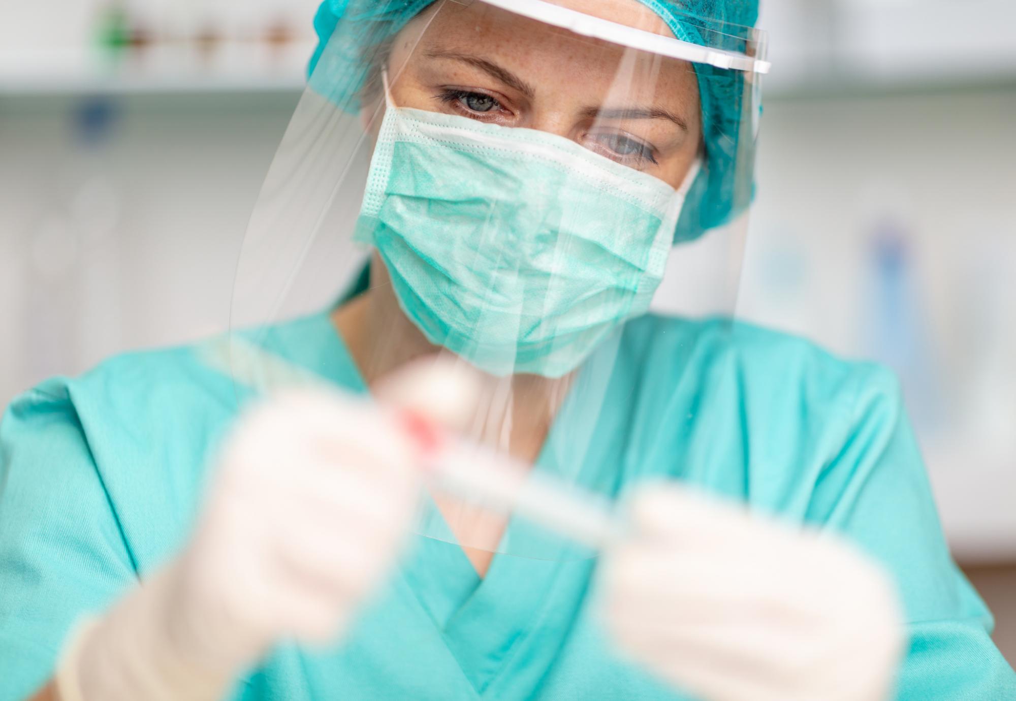 Female health professional wearing PPE