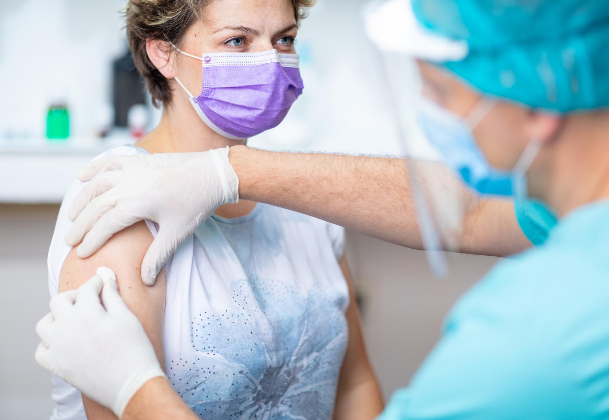 Woman receiving flu vaccination