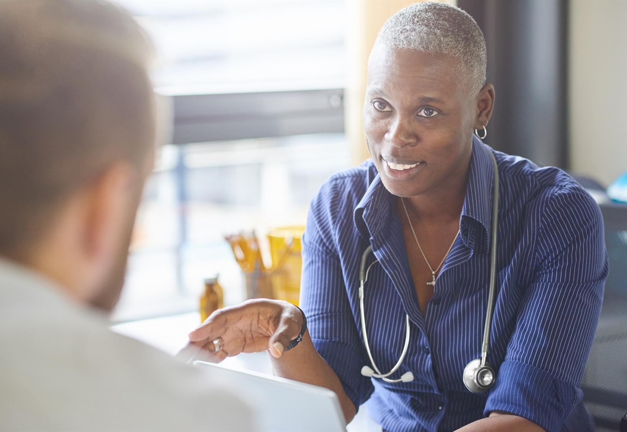 Female GP discussing with patient