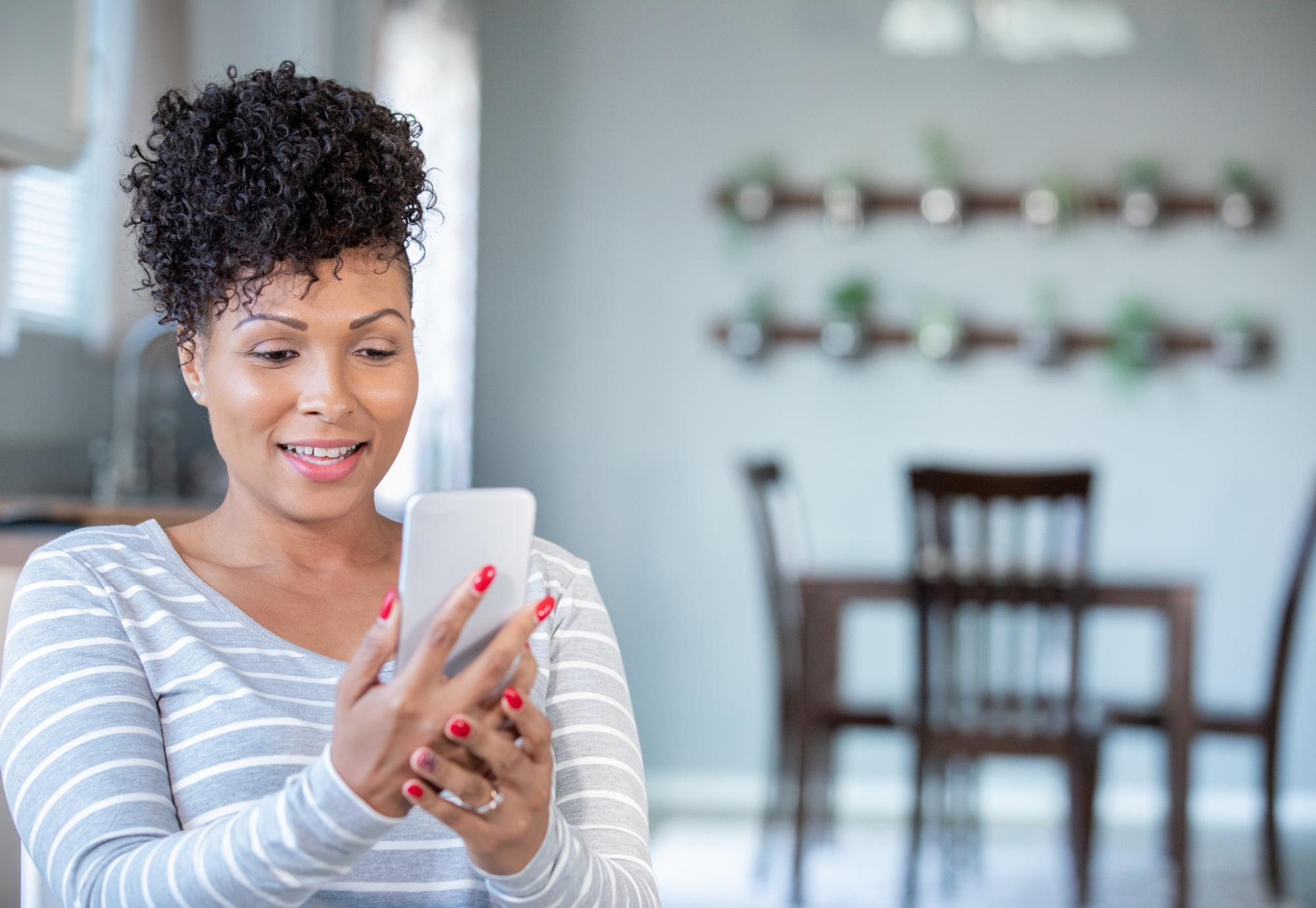 Young woman using her mobile phone