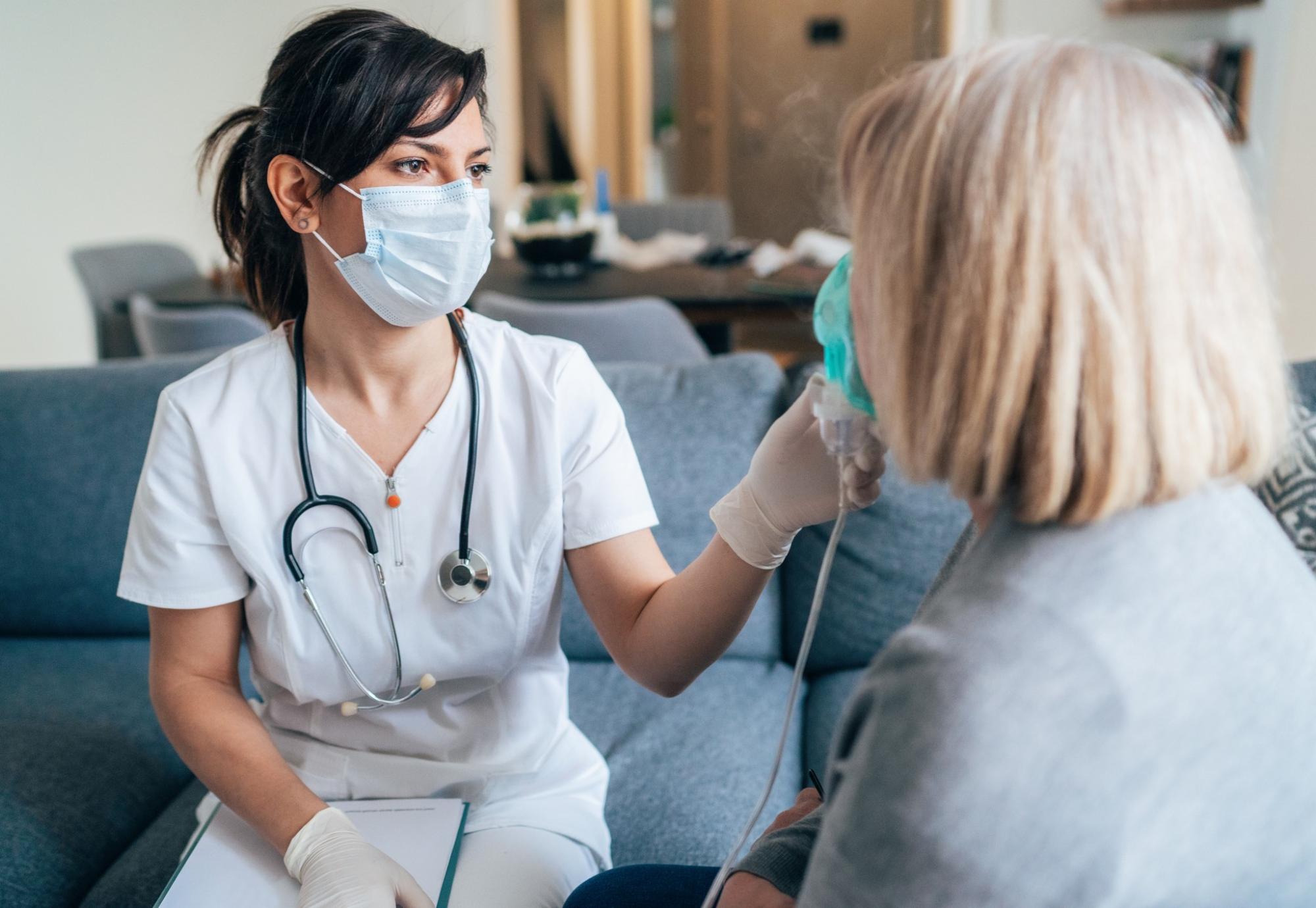 Health professional treating female patient