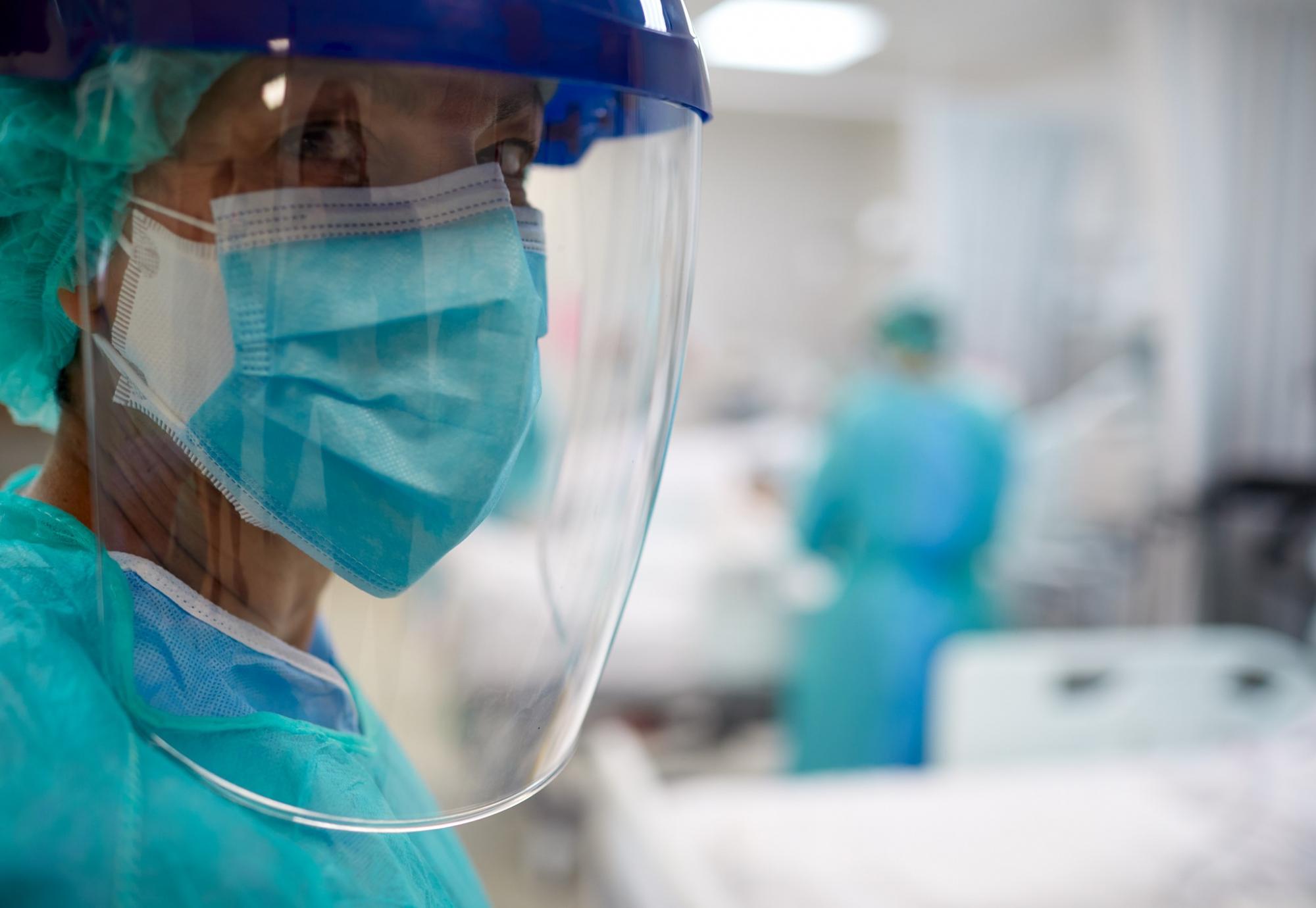 Health worker in PPE visor