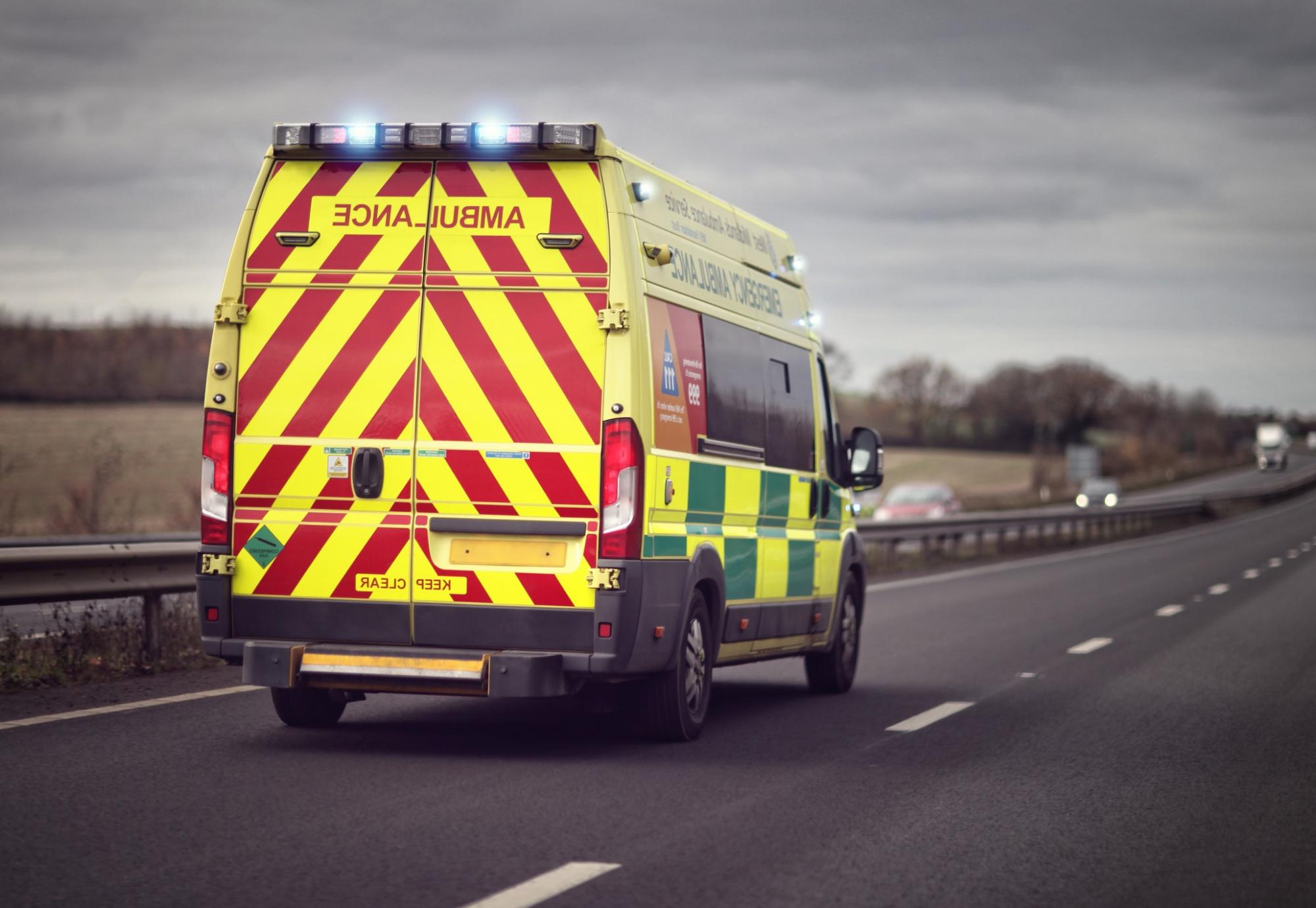 An ambulance on a road in the UK