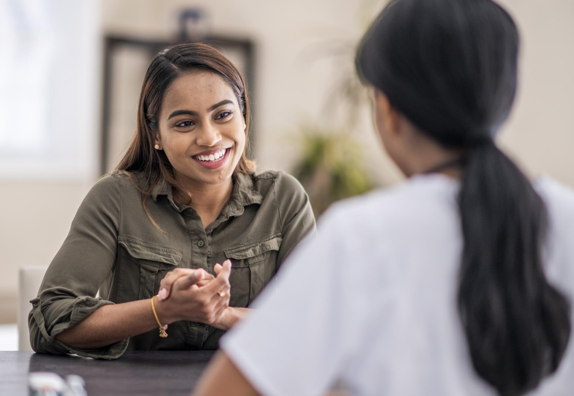 Woman having conversation with mental health professional