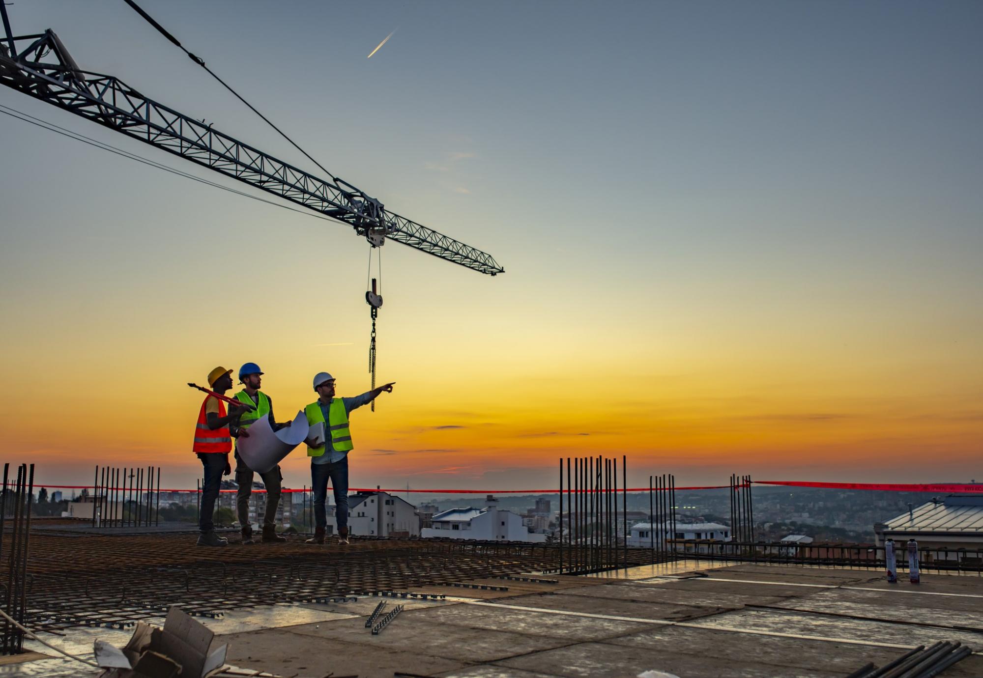 Construction workers stood atop a construction site