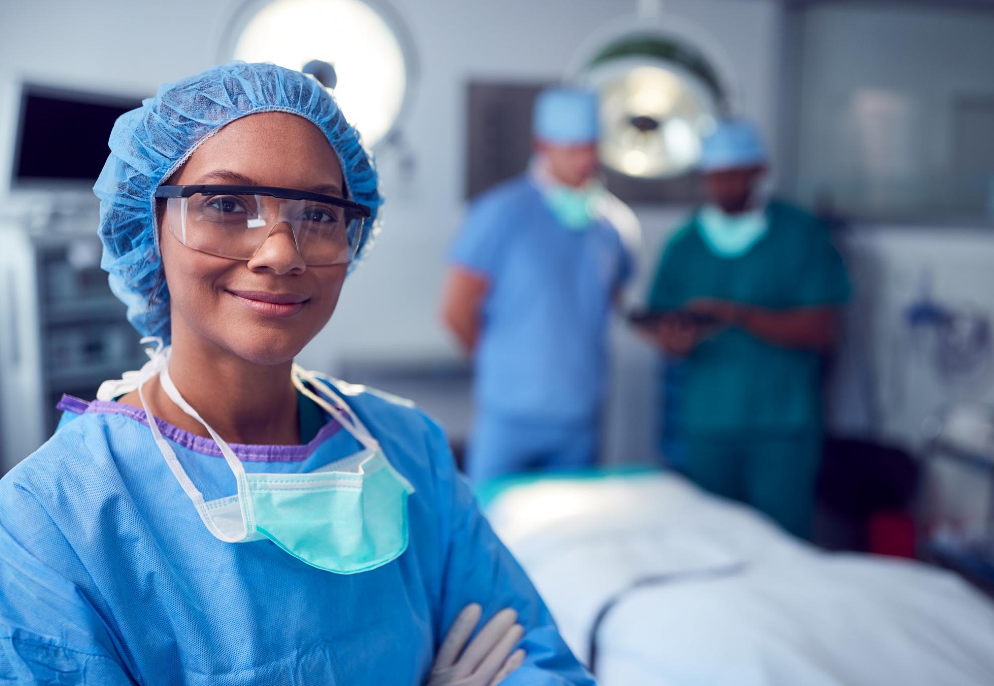 Surgical professional smiling toward the camera