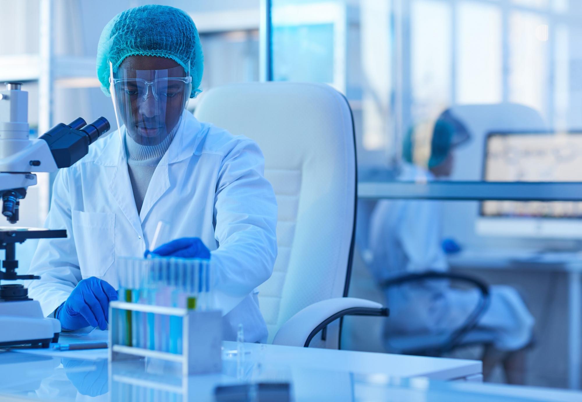 Male lab technician carrying out tests with lab equipment