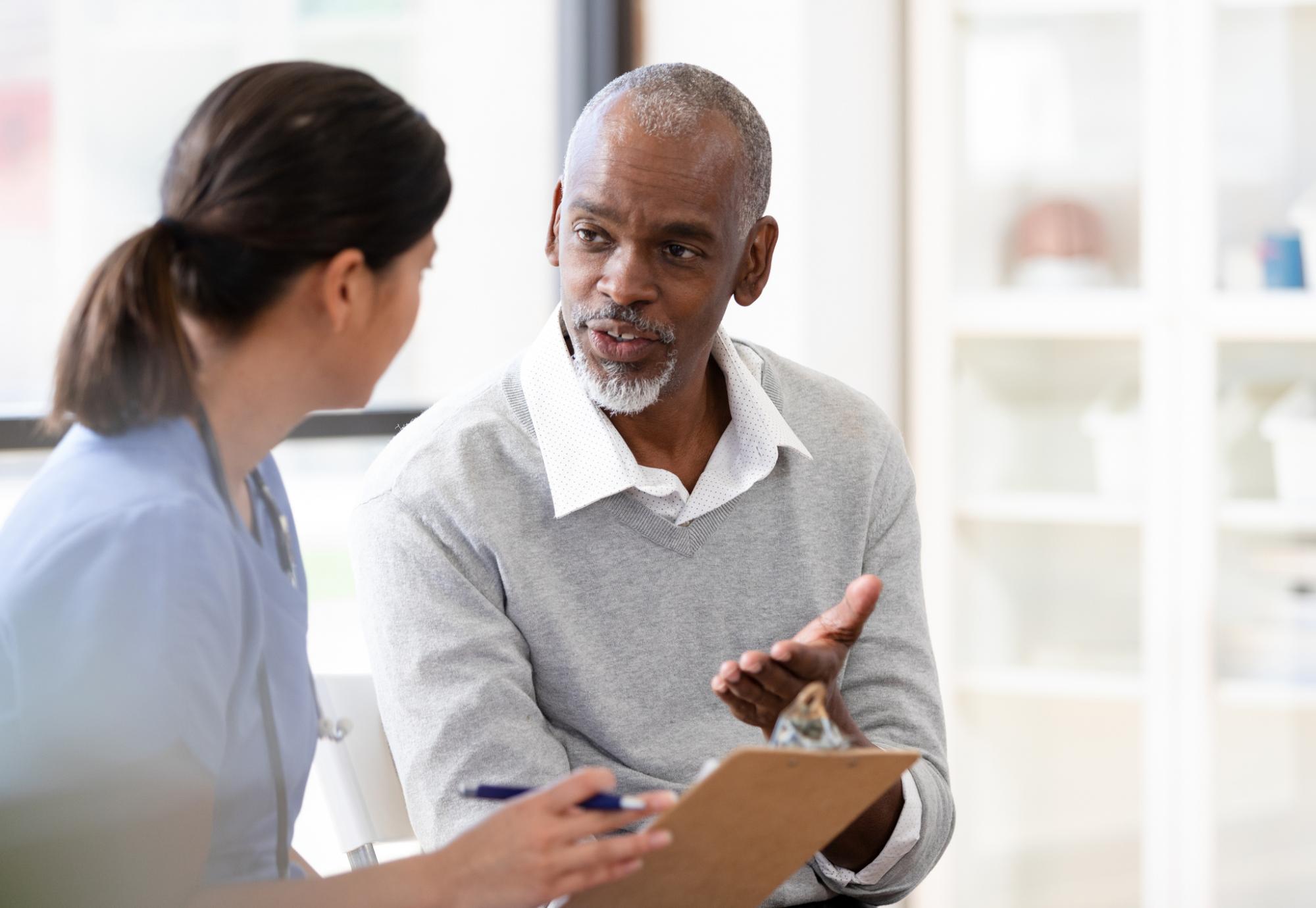 Patient in conversation with a health professional