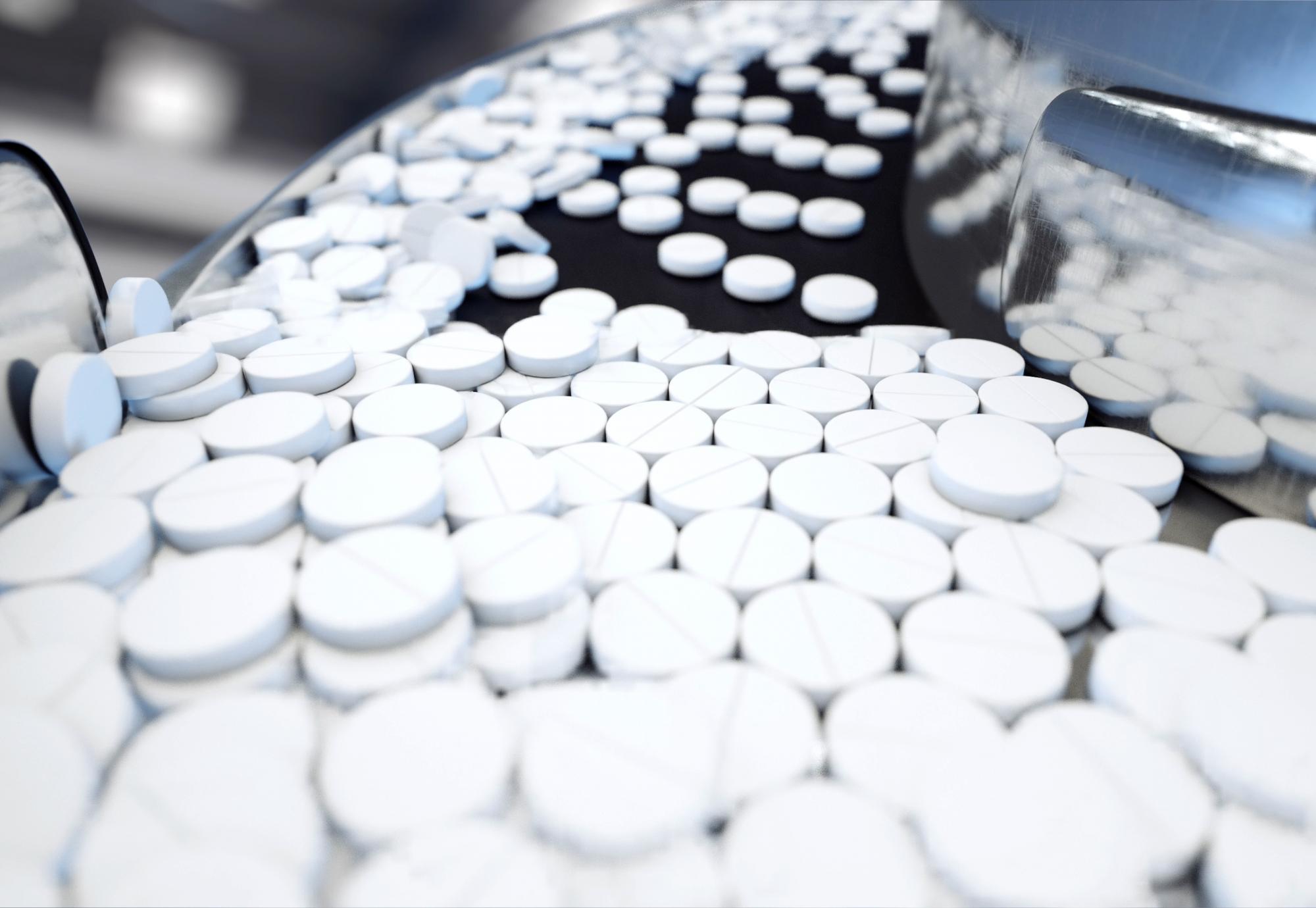 Medicine pills on a manufacturing conveyor belt