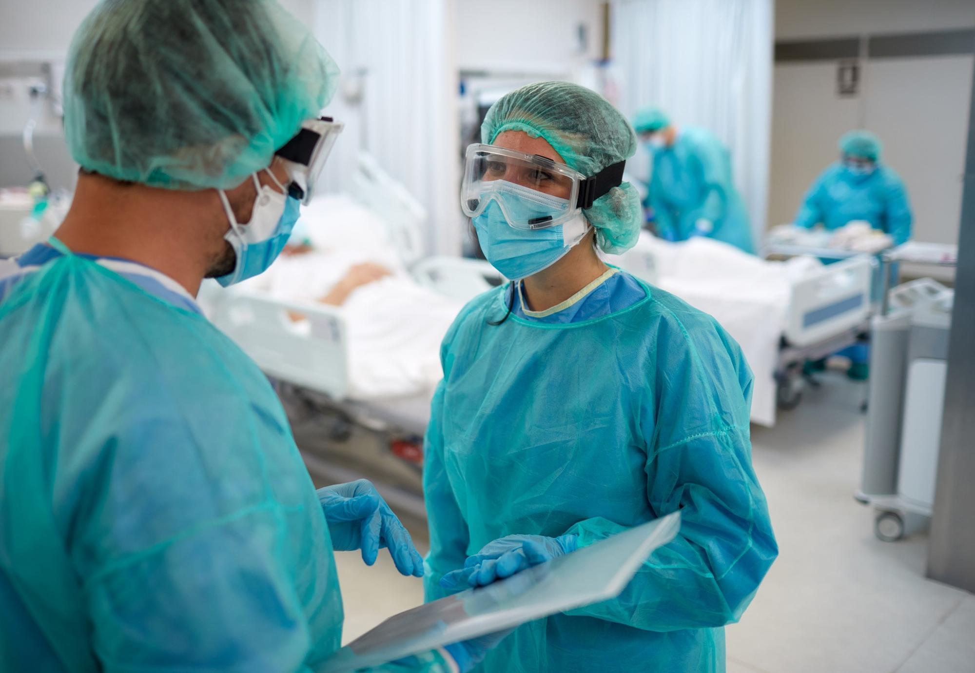 Medical professionals in discussion on a ward