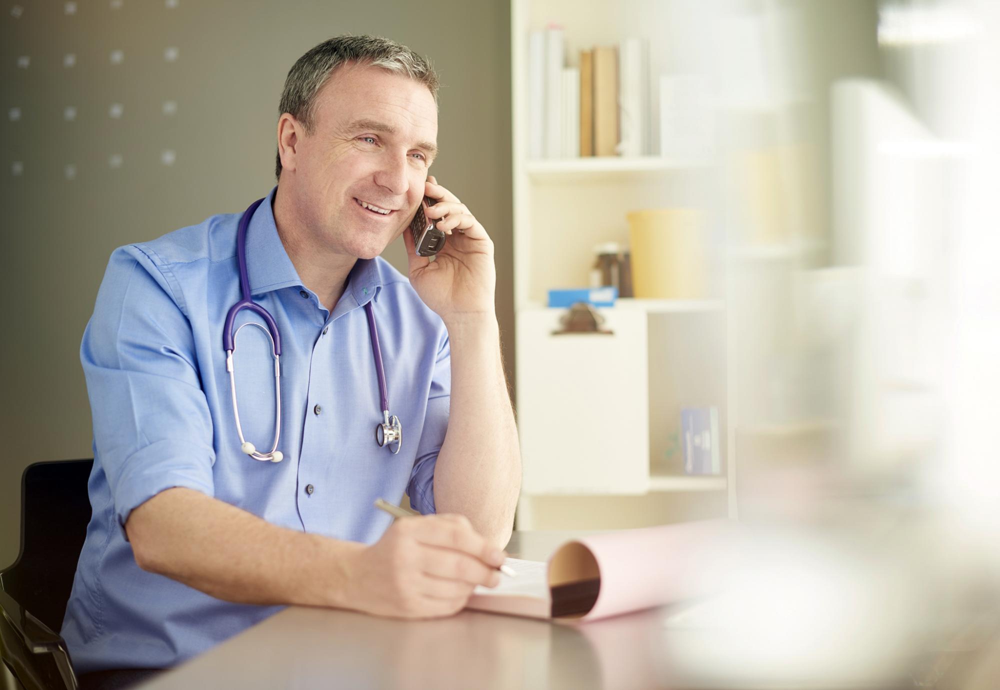 Male doctor on the phone