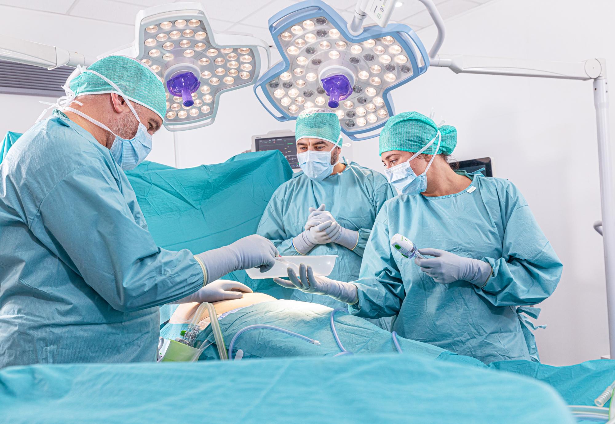 Surgical team performing an operation on a patient
