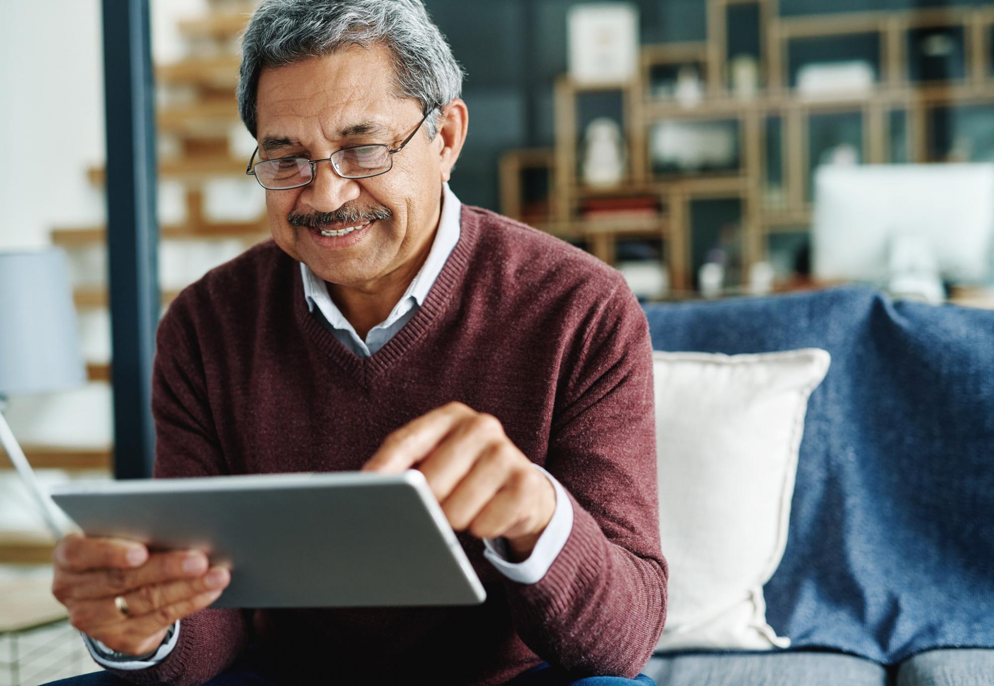 Older man using an iPad