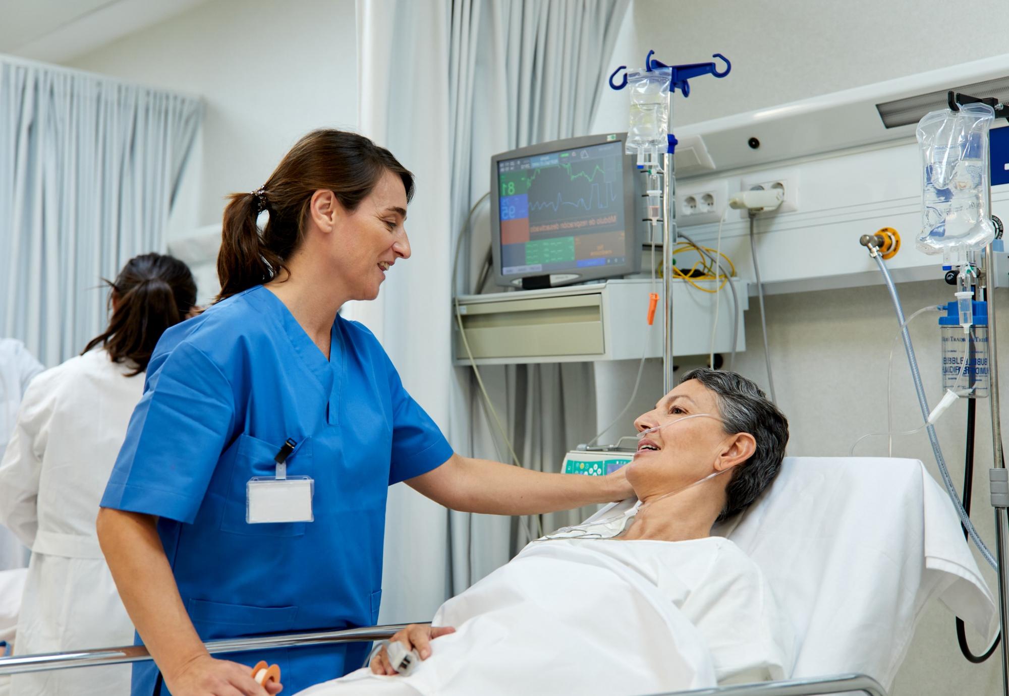 Female nurse checking on a patient