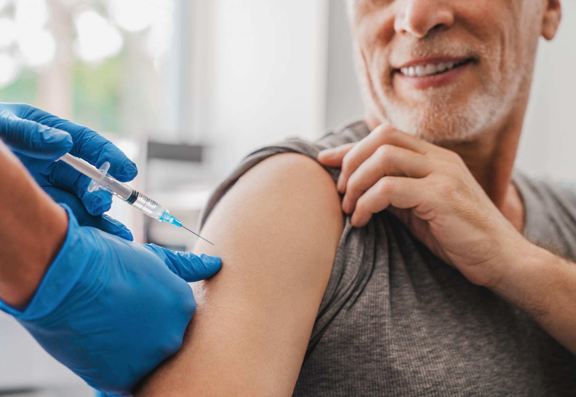 Man being administered a vaccine