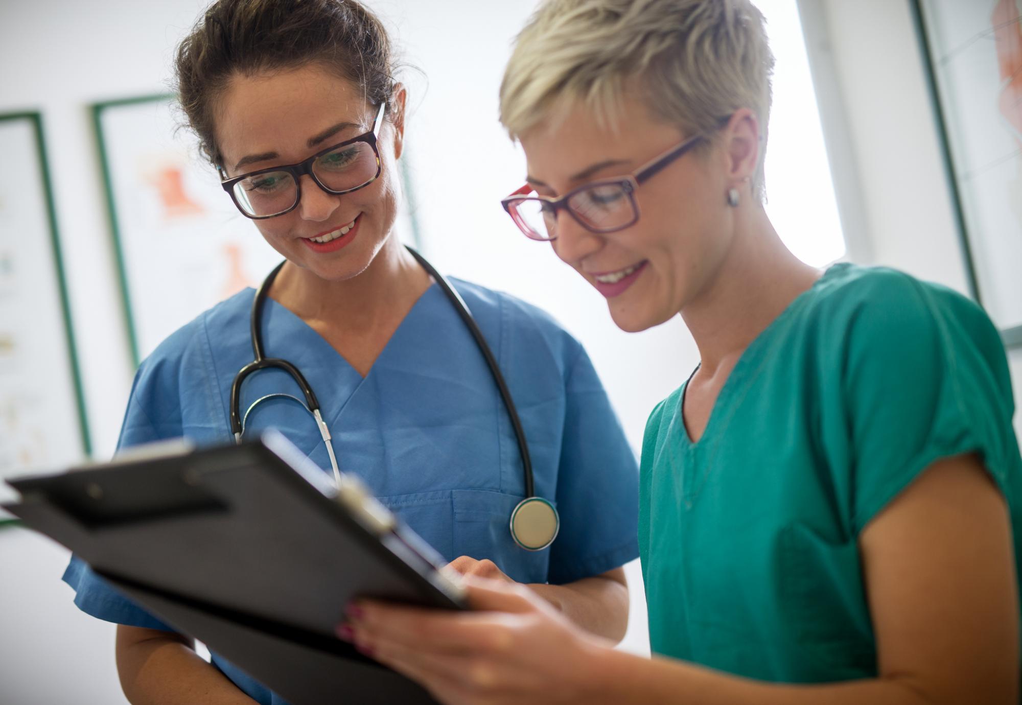 Student nurse discussing with her mentor