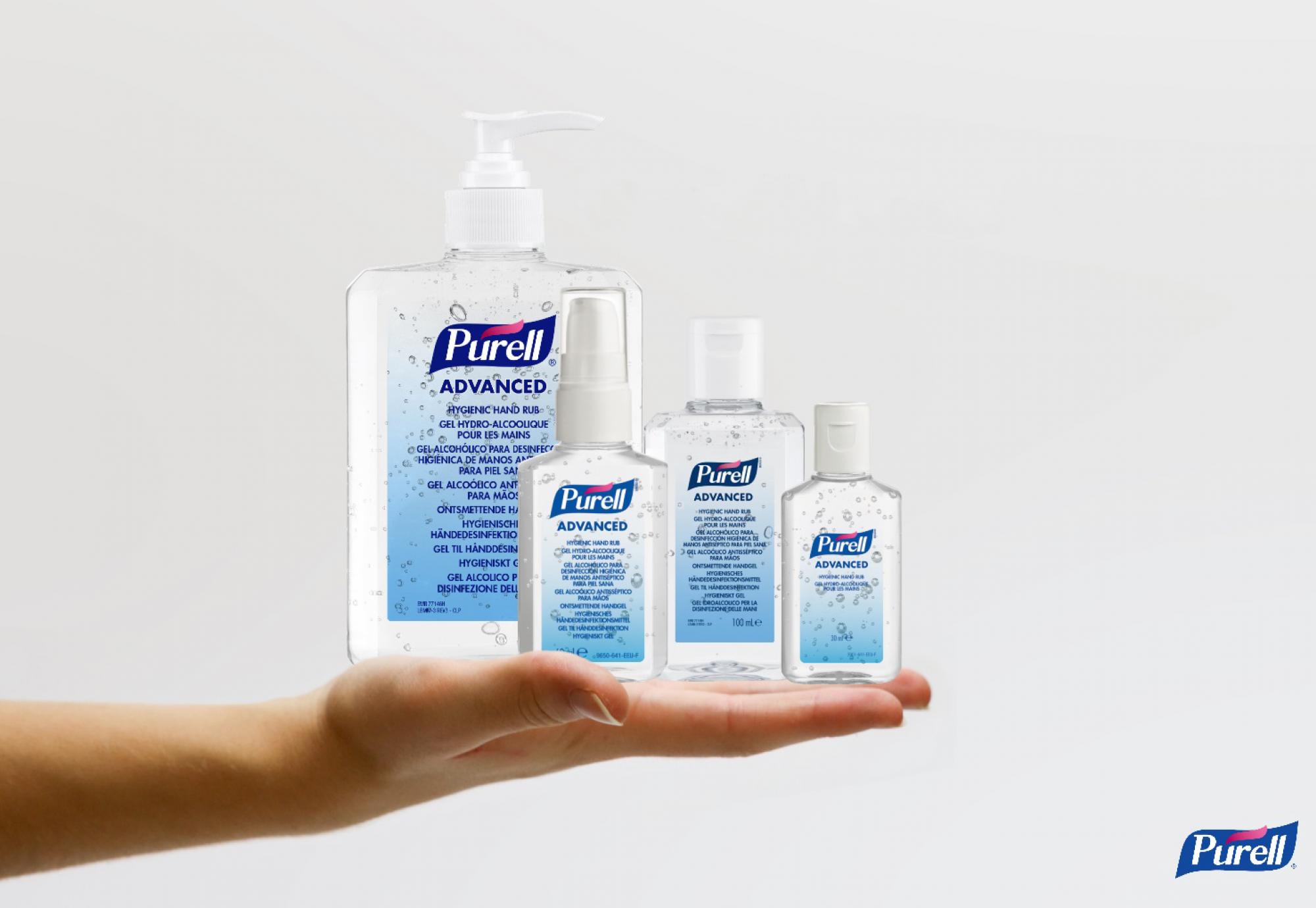 PURELL bottles being held up for display